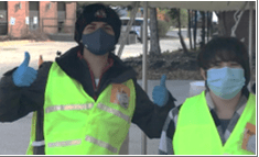 volunteer - people with masks, hats, and vests