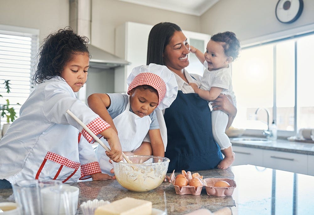 health promotion and wellness - woman baking with her children
