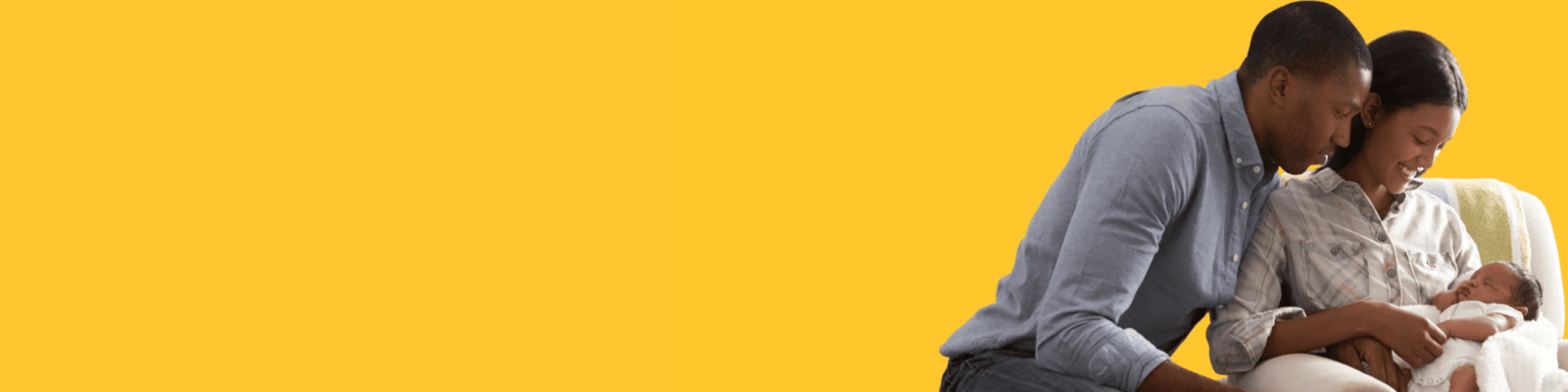 mother and father holding and smiling gown at their baby.